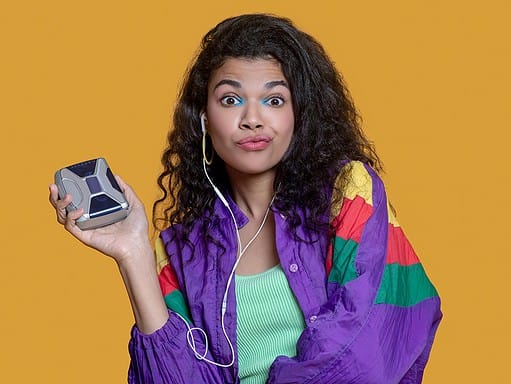 Girl holding an old walkman player, 80s and 90s nostalgia