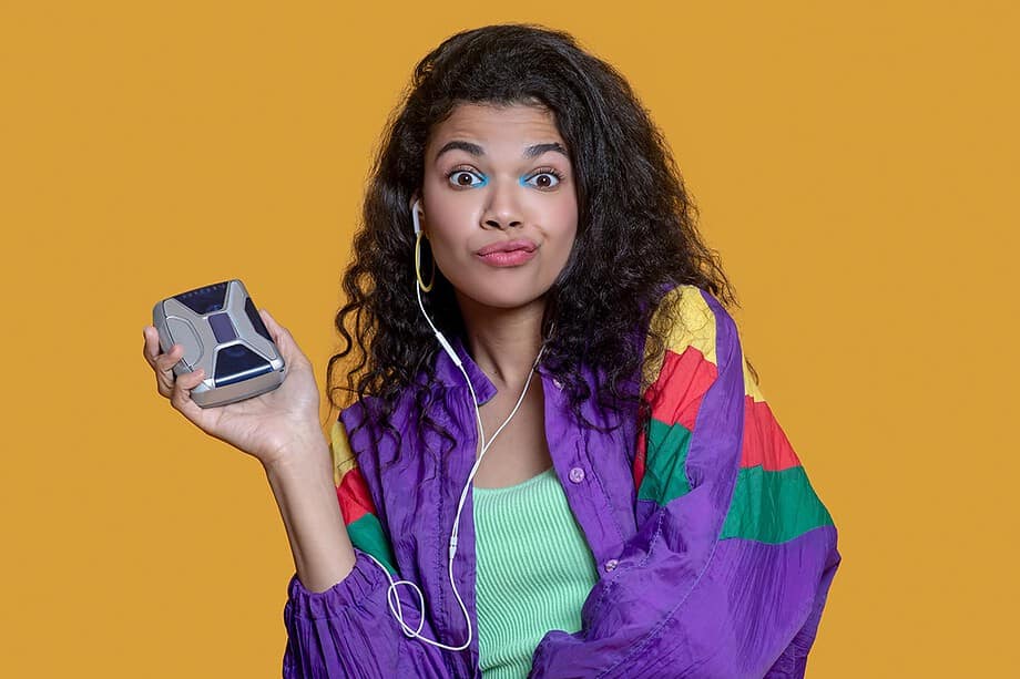 Girl holding an old walkman player, 80s and 90s nostalgia