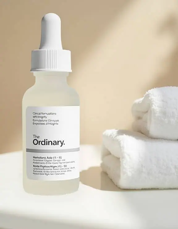 product-4-skincare Bottle of skincare product sat on a white table