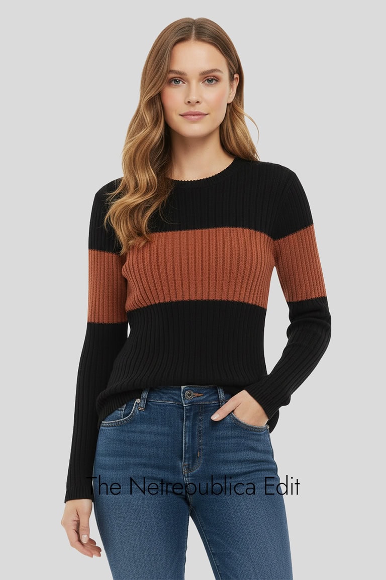 model wearing a color block sweater with jeans 