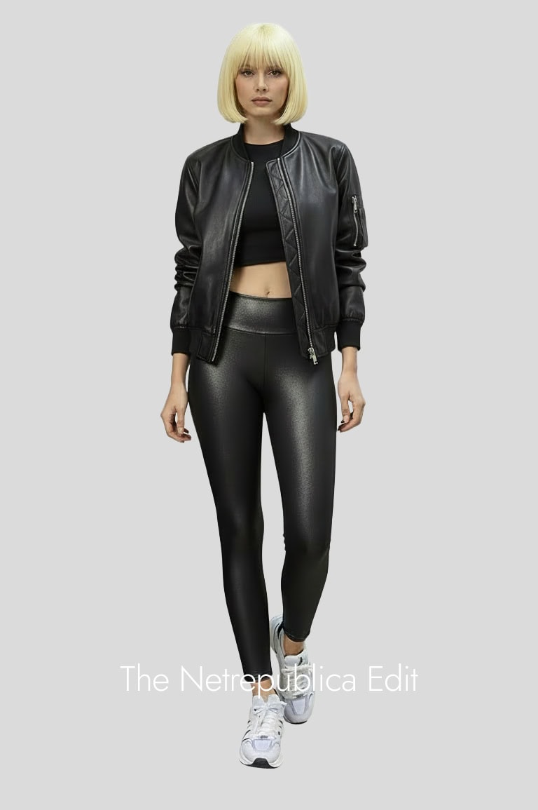 faux-leggings-1 woman wearing Faux Leather Leggings and a black leather jacket, on a grey light background