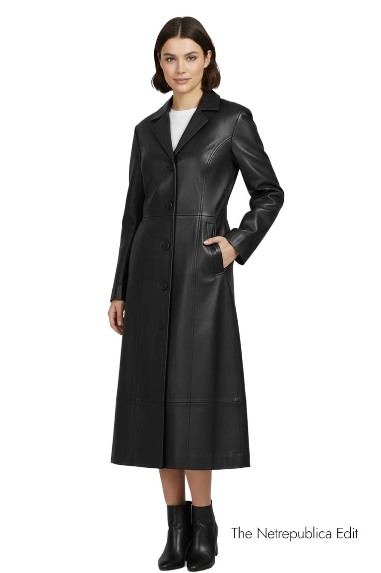 fashion model wearing a Black Leather Trench Coat in a studio white background